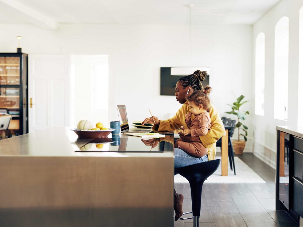 Individual practicing good posture at an ergonomic desk, highlighting lifestyle management for migraine prevention