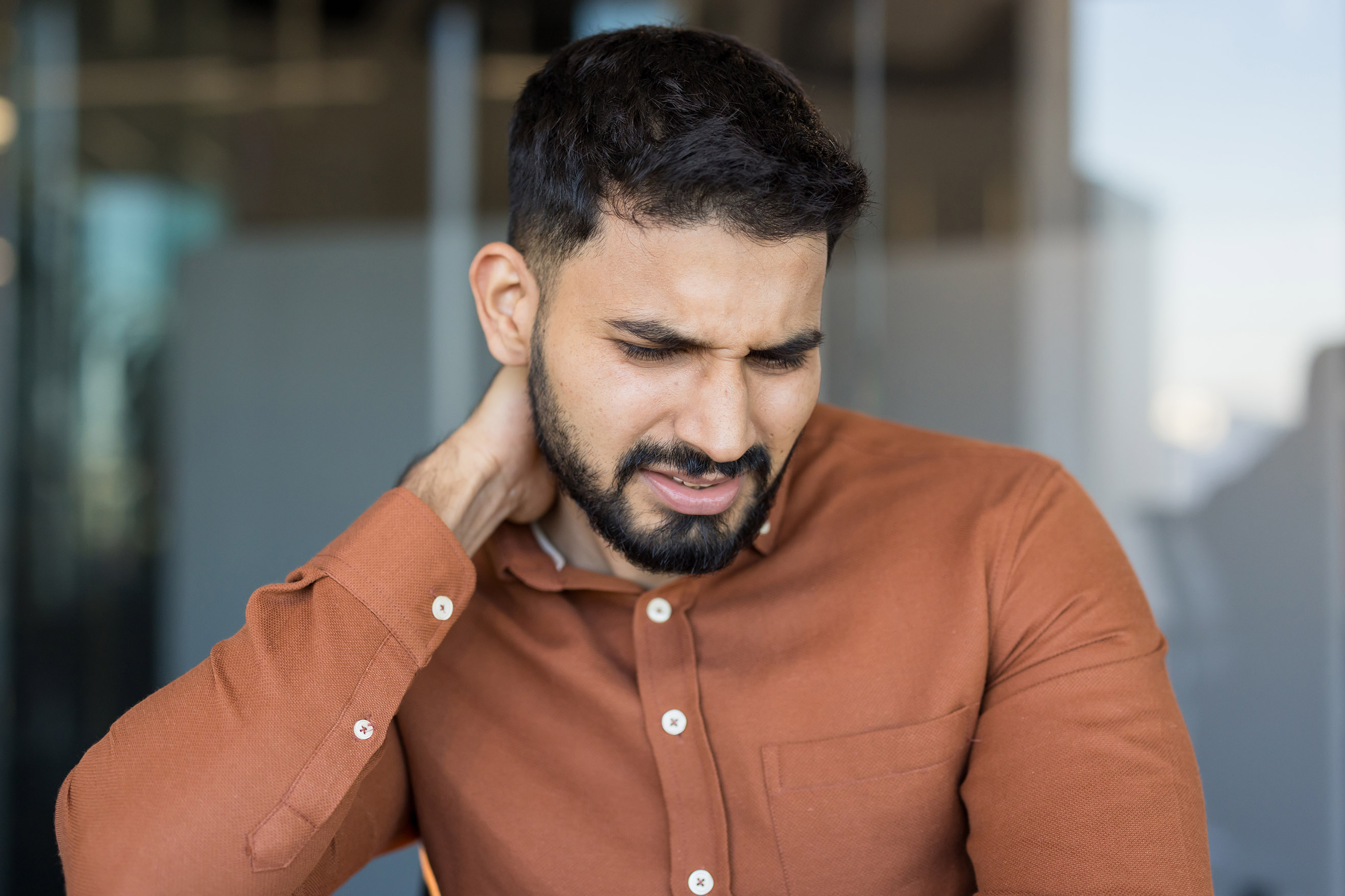 man with neck pain